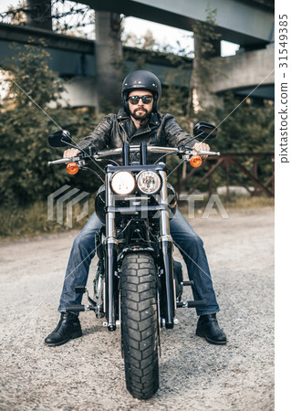 Handsome rider guy with beard in black biker 31549385