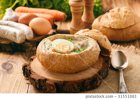 Traditional polish  soup - zurek, served in bread  31551081