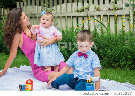 Happy mother and two children Happy mother and two children 31551237
