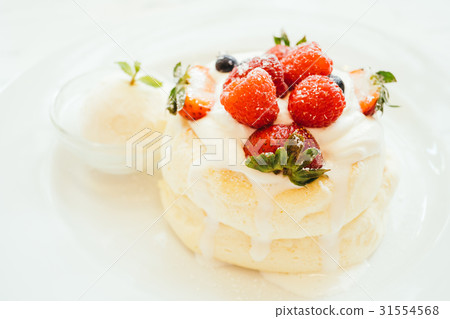 Pancake with ice cream strawberry , blueberry and raspberry Pancake with ice cream strawberry , blueberry and raspberry 31554568