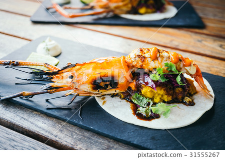 Taco with prawn or shrimp and sauce Taco with prawn or shrimp and sauce 31555267