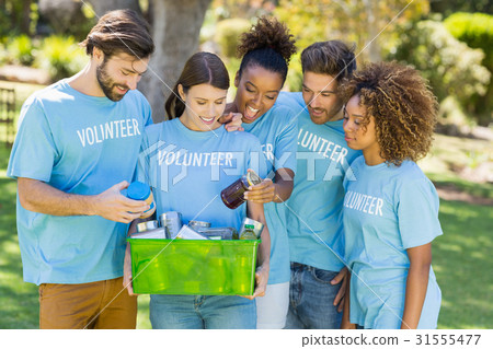 Group of volunteer holding box 31555477