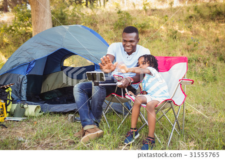 Happy family lying on a chair together Happy family lying on a chair together 31555765