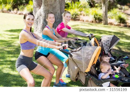 Women exercising with baby stroller 31556199
