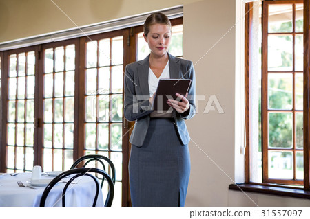 Woman writing on clipboard Woman writing on clipboard 31557097