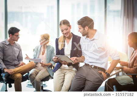 Business people interacting with each other 31557182