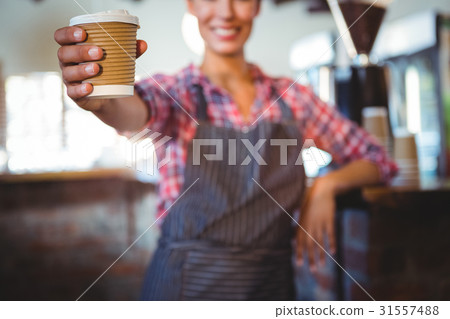 Waitress holding a cup of coffee 31557488