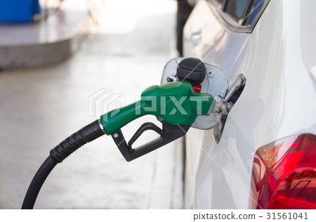 Fuel nozzles adding gasoline fuel in car  31561041