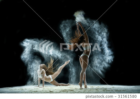 Girls in a cloud of white dust studio portrait Girls in a cloud of white dust studio portrait 31561580