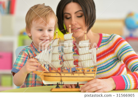 Young mother playing with son Young mother playing with son 31566905