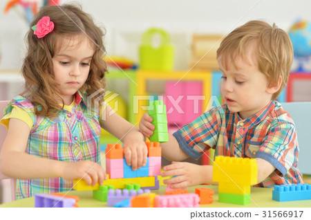 Brother and sister playing together Brother and sister playing together 31566917