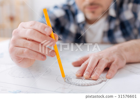 Close up of male hands that using stationery Close up of male hands that using stationery 31576601