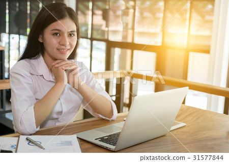 businesswoman using laptop computer at workplace businesswoman using laptop computer at workplace 31577844