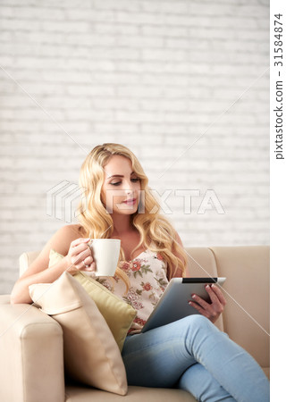 Beautiful Woman Reading at Home 31584874