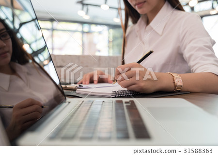 businesswoman analyze market report at workplace.  businesswoman analyze market report at workplace.  31588363