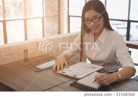 businesswoman analyze market chart at workplace businesswoman analyze market chart at workplace 31588368