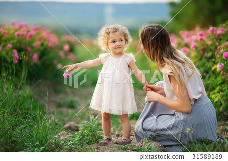 Beautiful young child girl with mother are wearing Beautiful young child girl with mother are wearing 31589189