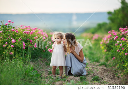 Beautiful young child girl with mother are wearing Beautiful young child girl with mother are wearing 31589190