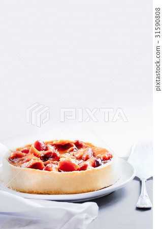 Peach and plum tart 31590808