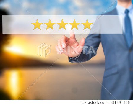 Five star rating Businessman hand pressing button Five star rating Businessman hand pressing button 31591106