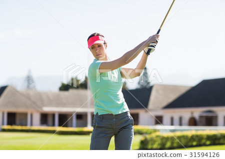 Golfer woman taking shot 31594126