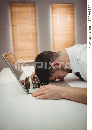 Stressed man in office 31594431