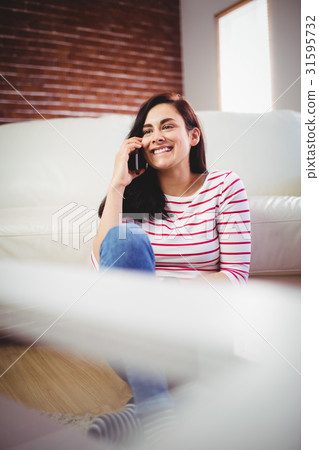 Beautiful woman talking on phone 31595732