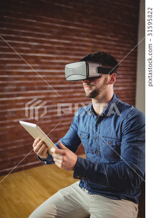 Man with virtual glass holding tablet 31595822