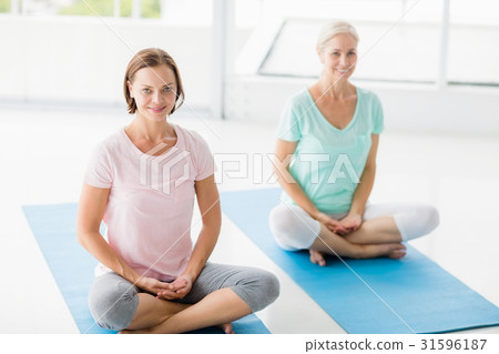 Portrait of smiling women doing yoga Portrait of smiling women doing yoga 31596187