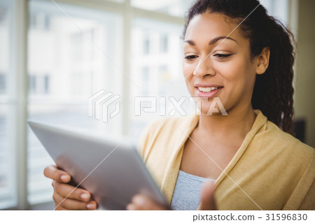 Close-up of businesswoman using digital tablet 31596830