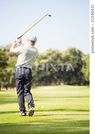 Golf player taking shot 31596831