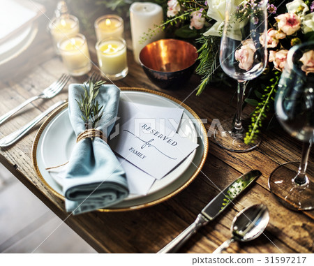 Elegant Restaurant Table Setting Service for Reception with Reserved Card 31597217