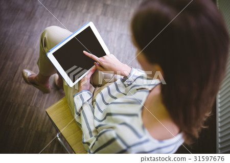 High angle view of executive using tablet at office 31597676