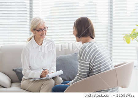 Smiling therapist with patient 31598452