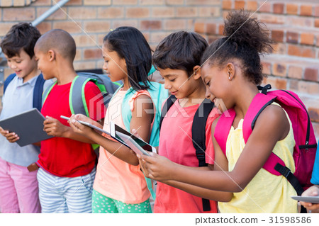 Students using digital tablets Students using digital tablets 31598586