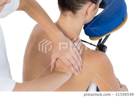 Naked woman being back massaged by masseuse Naked woman being back massaged by masseuse 31598599