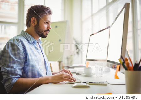 Businessman working in creative office 31599493