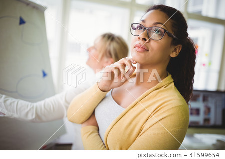 Thoughtful businesswoman in creative office Thoughtful businesswoman in creative office 31599654