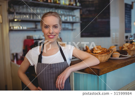 Portrait of confident female barista at cafe 31599984