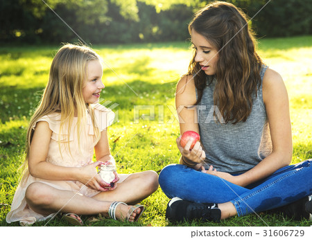 Sister Girls Talk Picnic Togetherness Outdoors Concept 31606729