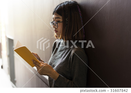 Girl with Glasses Standing Reading Book Girl with Glasses Standing Reading Book 31607842