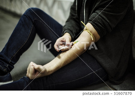 Junkie People Using Syringe Injecting Narcotic Illegal Drugs 31607870