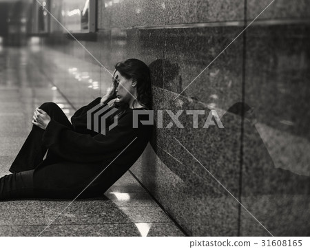 Adult Woman Sitting Hopeless on The Floor Adult Woman Sitting Hopeless on The Floor 31608165