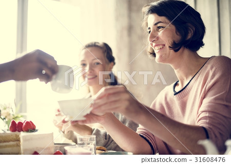 Friends Gathering Together on Tea Party Eating Cakes Enjoyment h Friends Gathering Together on Tea Party Eating Cakes Enjoyment h 31608476