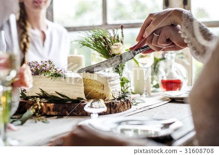 Bride and Groom Cutting Cake on Wedding Reception 31608708