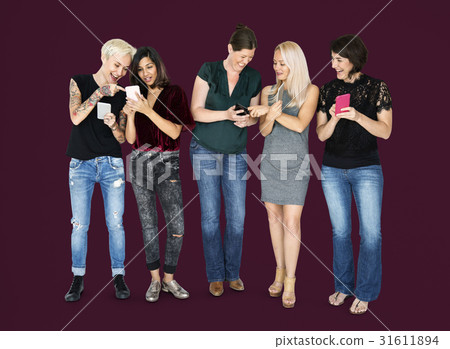 Happiness group of girlfriends smiling and conneted by mobile phone Happiness group of girlfriends smiling and conneted by mobile phone 31611894