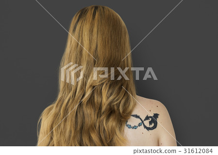 Young Adult Woman Back with Tattoo Studio Portrait 31612084