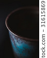 Blue vintage ceramic cup side close up 31615869
