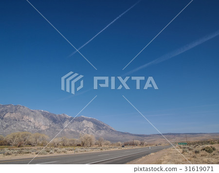 Snow capped mountains, blue sky, Desert landscape Snow capped mountains, blue sky, Desert landscape 31619071