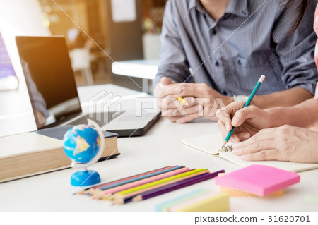 Young woman and man studying for a test/ an exam 31620701